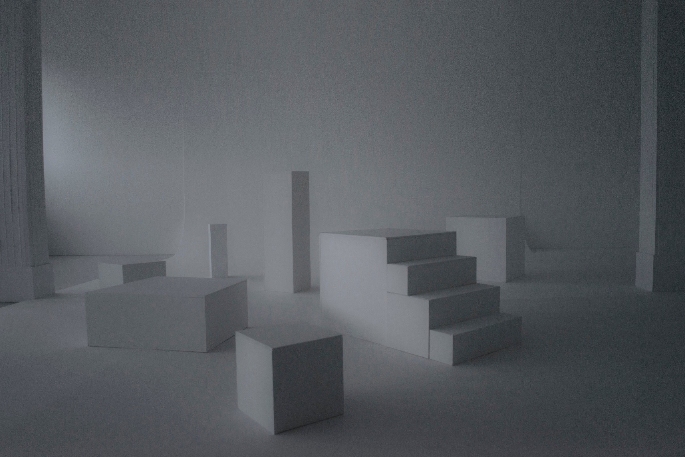 Picturepool Studios equipment — white geometric decor blocks in a dark, dimly lit studio