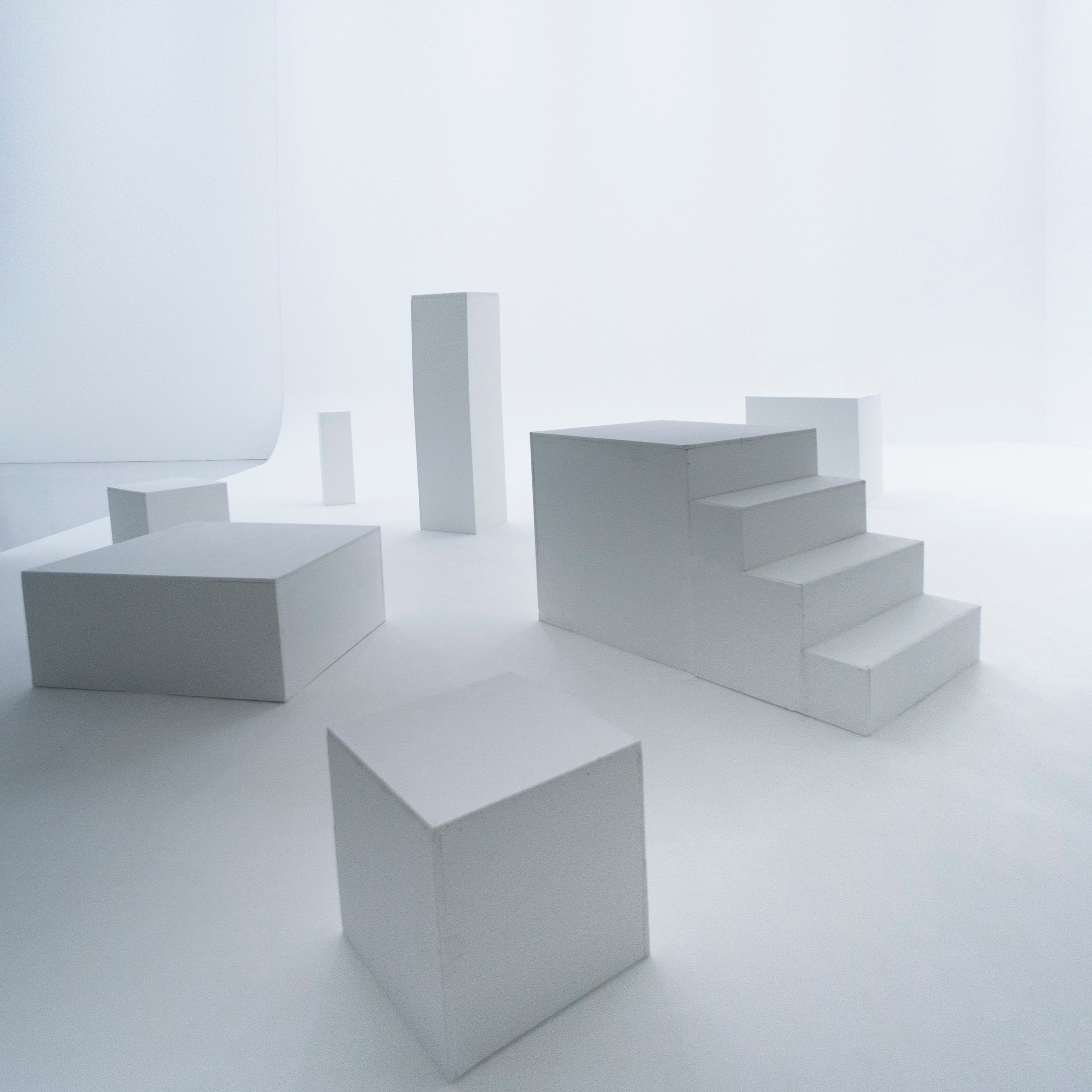 Picturepool Studios equipment — white geometric decor blocks (cubes, rectangles, stairs) in a bright studio