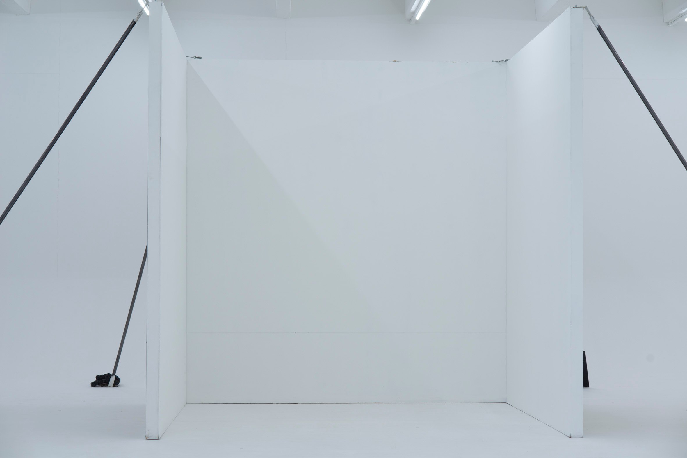 Picturepool Studios equipment — mobile wall viewed from the front, with support poles bracing both sides