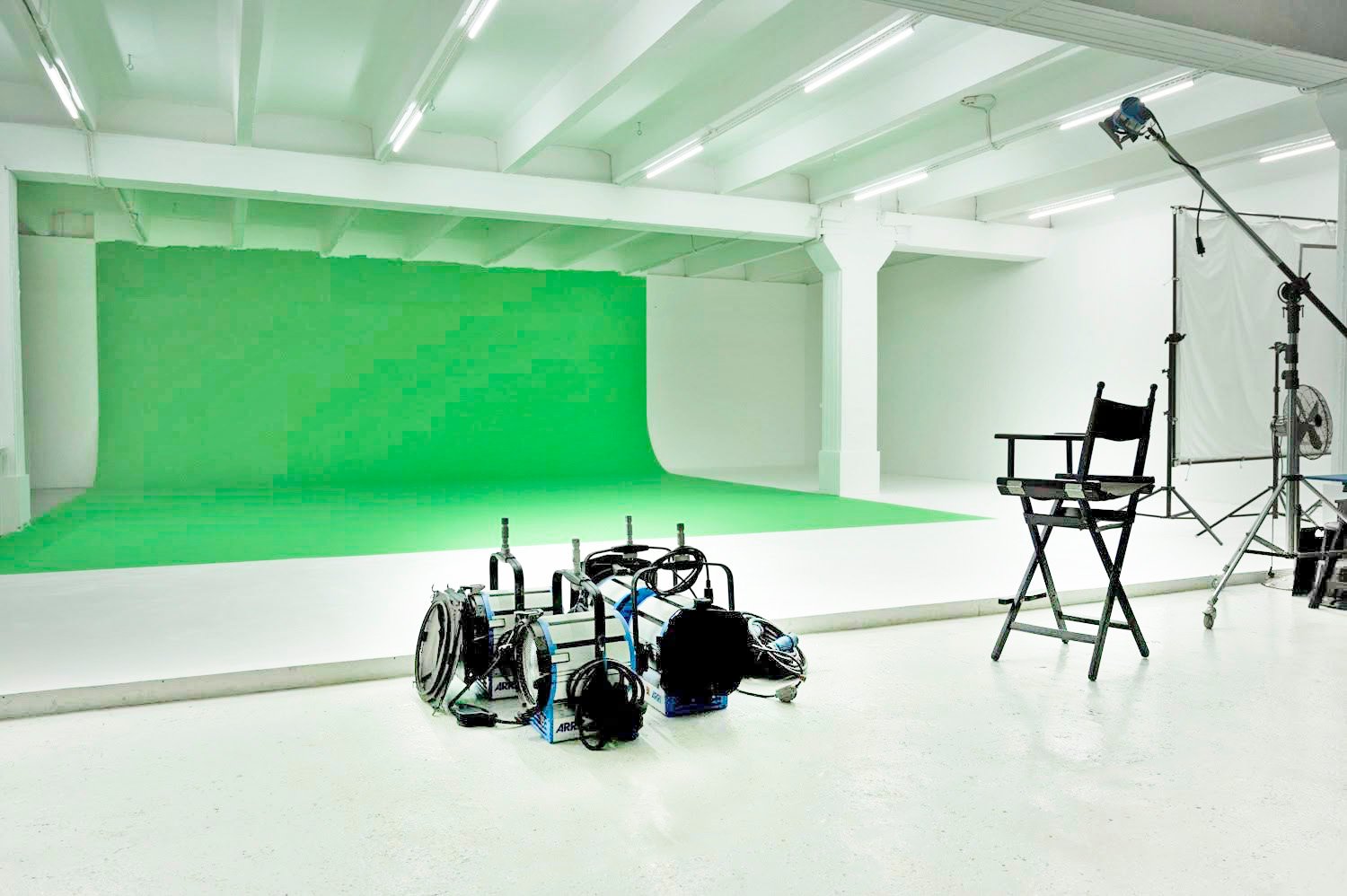 Picturepool Studios — large green screen backdrop with studio lights, a director's chair and lighting stands